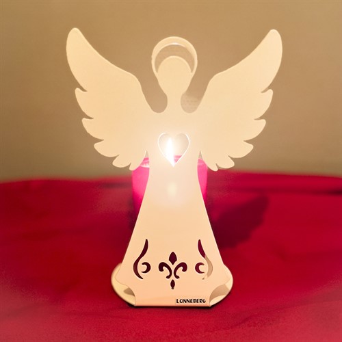 Rött blockljus bakom ängel