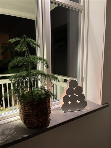 Snow lantern in a window